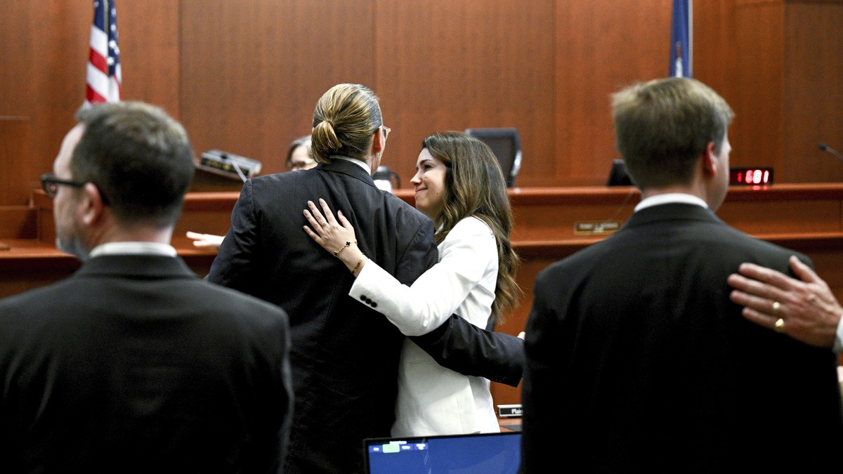 Actor Johnny Depp hugs attorney Camille Vasquez in the courtroom at the Fairfax County Circuit Courthouse in Fairfax, Va., Tuesday, May 17, 2022. Actor Johnny Depp sued his ex-wife Amber Heard for lib ...