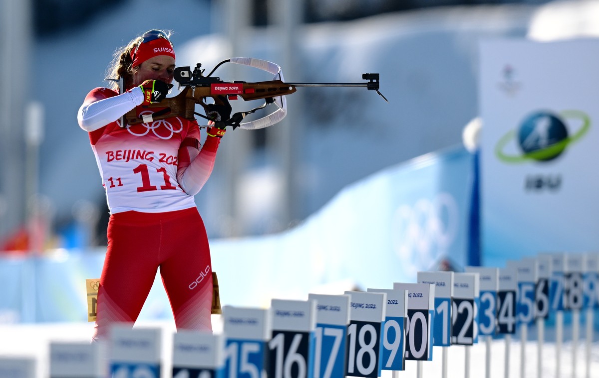 epa09761334 Irene Cadurisch of Switzerland in action during the Women's Biathlon 4x6km Relay race at the Zhangjiakou National Biathlon Centre at the Beijing 2022 Olympic Games, Zhangjiakou, China ...