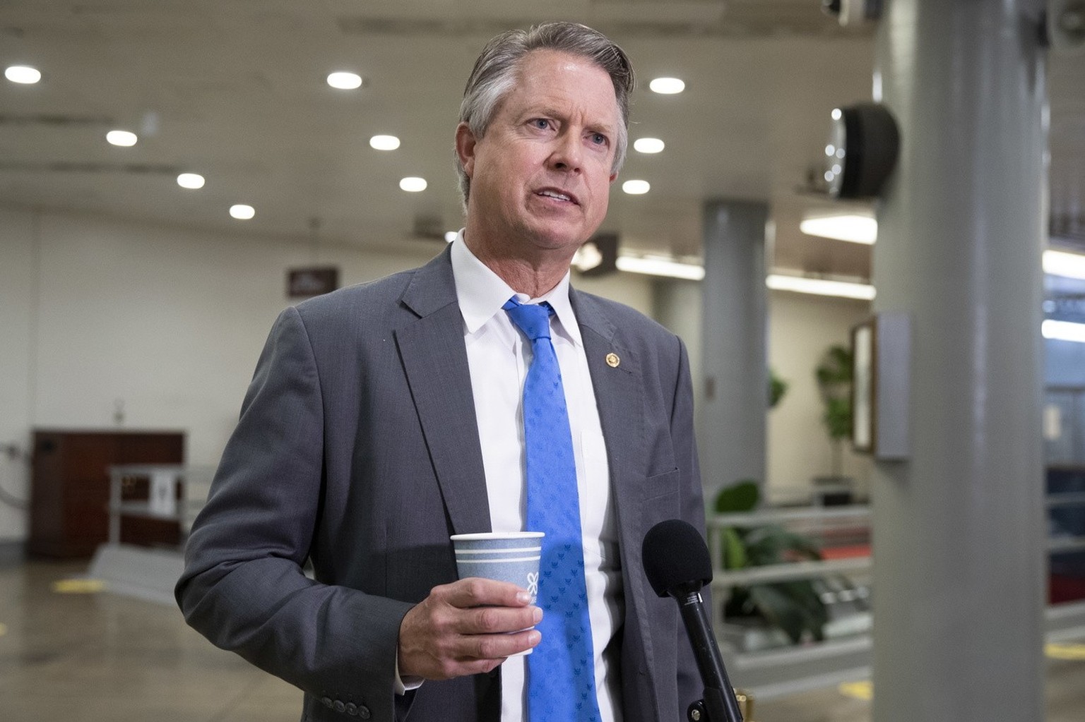 epa09010233 Republican Senator from Kansas Roger Marshall responds to questions from members of the news media during a break on the fifth day of the second impeachment trial of US President Donald J. ...