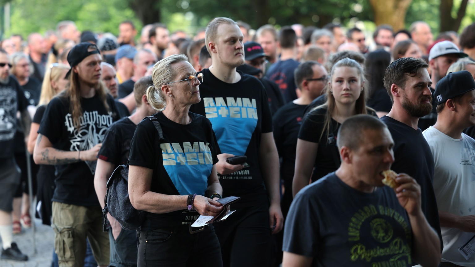 epa10680244 People wait in line to enter the venue of a concert by German band Rammstein at the Olympic Stadium in Munich, Germany June 08, 2023. Despite allegations of sexual abuse against the…