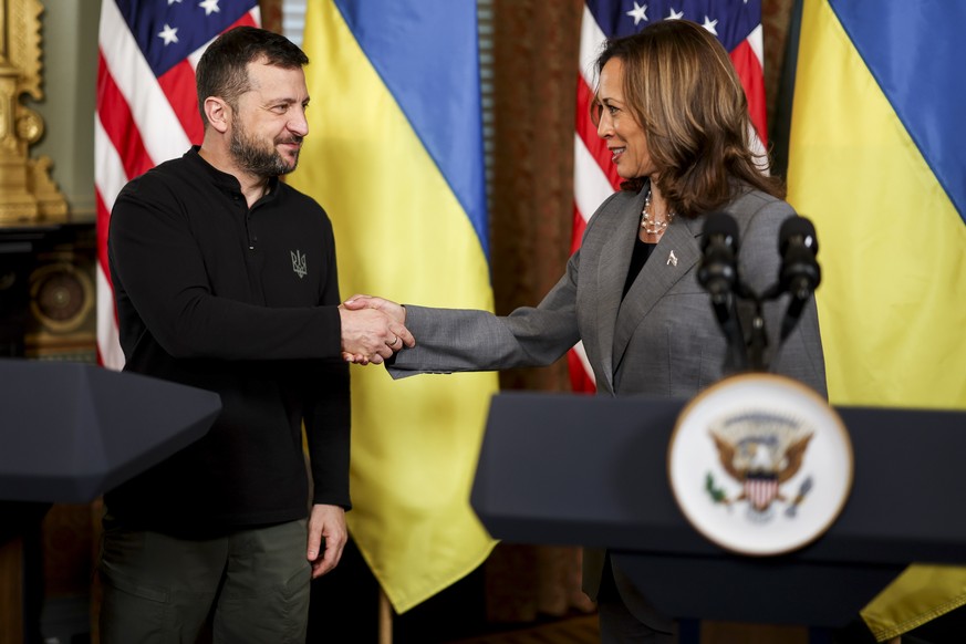 epa11627251 US Vice President Kamala Harris (R), and Ukrainian President Volodymyr Zelensky (L), shake hands at their joint press conference during a meeting in the Vice President&#039;s Ceremonial Of ...