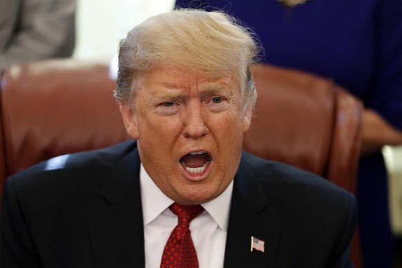 President Donald Trump speaks during a meeting with American manufacturers in the Oval Office of the White House, Thursday, Jan. 31, 2019, in Washington. Trump was signing an executive order pushing t ...