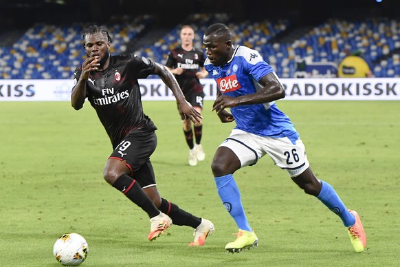 epa08542608 Milan's midfielder Franck Kessie' (L) and Napoli's defender Kalidou Koulibaly in actionduring the Italian Serie A soccer match SSC Napoli vs AC Milan at the San Paolo stadium in Naples, It ...
