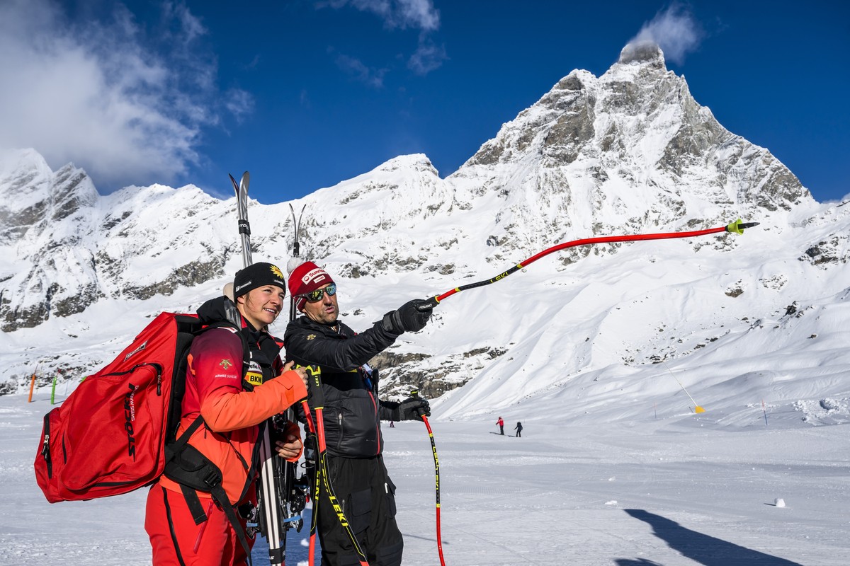 epa10975981 Jasmina Suter of Switzerland talks to Swiss-ski coach Ivano Nesa in front of the Matterhorn at the FIS Alpine Skiing World Cup event between Zermatt in Switzerland and Cervinia in Italy, 1 ...