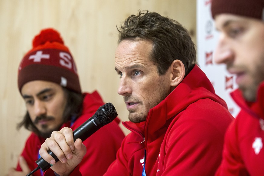 Eric Blum of Switzerland, Switzerland&#039;s head coach Patrick Fischer, and Romain Loeffel of Switzerland, from left, during a media conference of the Swiss men ice hockey national team in the House  ...