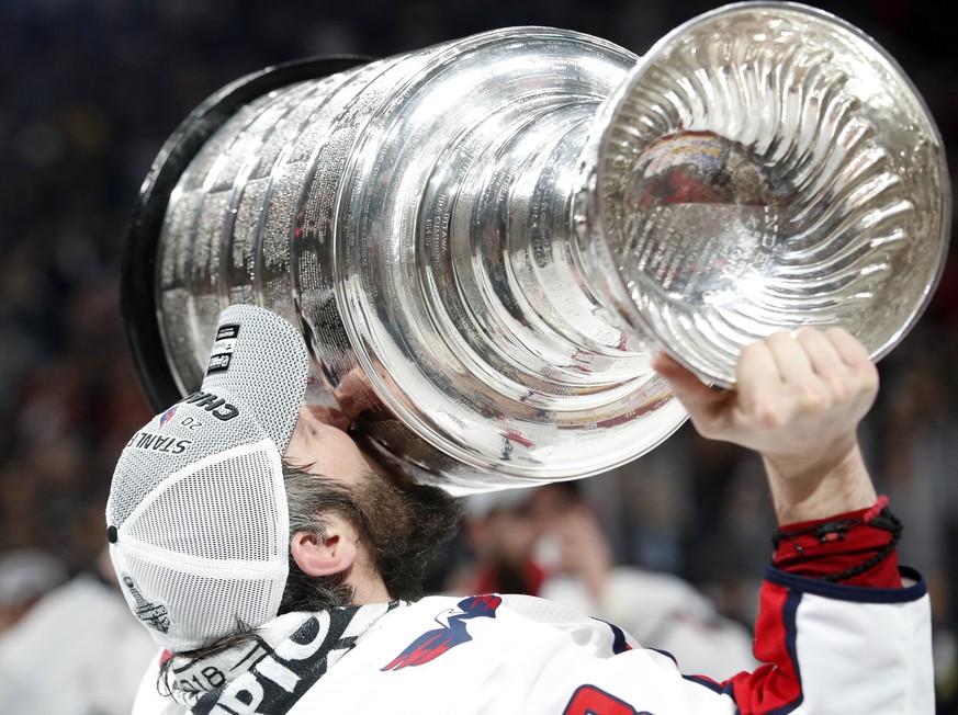 Washington Capitals left wing Alex Ovechkin, of Russia, kisses the Stanley Cup after the Capitals defeated the Golden Knights in Game 5 of the NHL hockey Stanley Cup Finals Thursday, June 7, 2018, in  ...