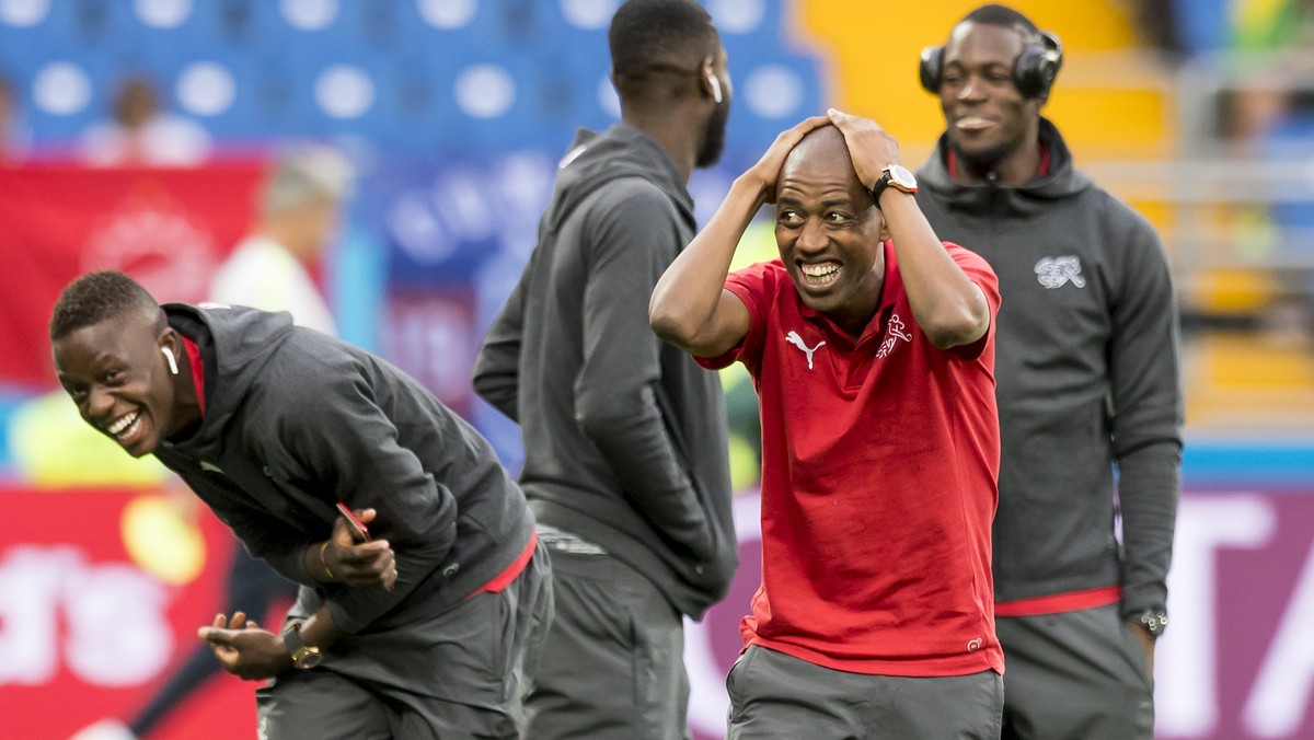 Switzerland's soccer players Denis Zakaria, Johan Djourou, Gelson Fernandes, and goalkeeper Yvon Landry Mvogo, from left to right, react before during the FIFA soccer World Cup 2018 group E match ...