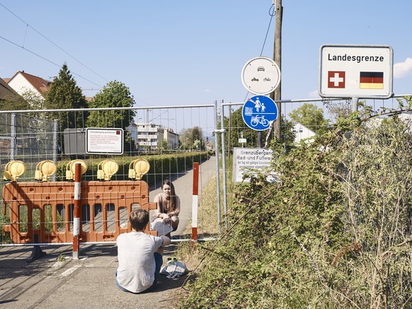 In this image released by World Press Photo, Thursday April 15, 2021, by Roland Schmid, part of a series titled Cross-Border Love, which won the second prize in the General News Stories category, show ...