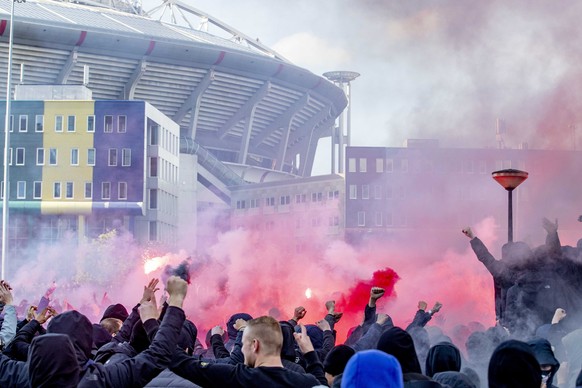 epa07556407 Supporters of Ajax cheer outside the &#039;Johan Cruijff ArenA&#039; prior to the UEFA Champions League, second leg soccer match between Ajax and Tottenham Hotspur in Amsterdam, The Nether ...