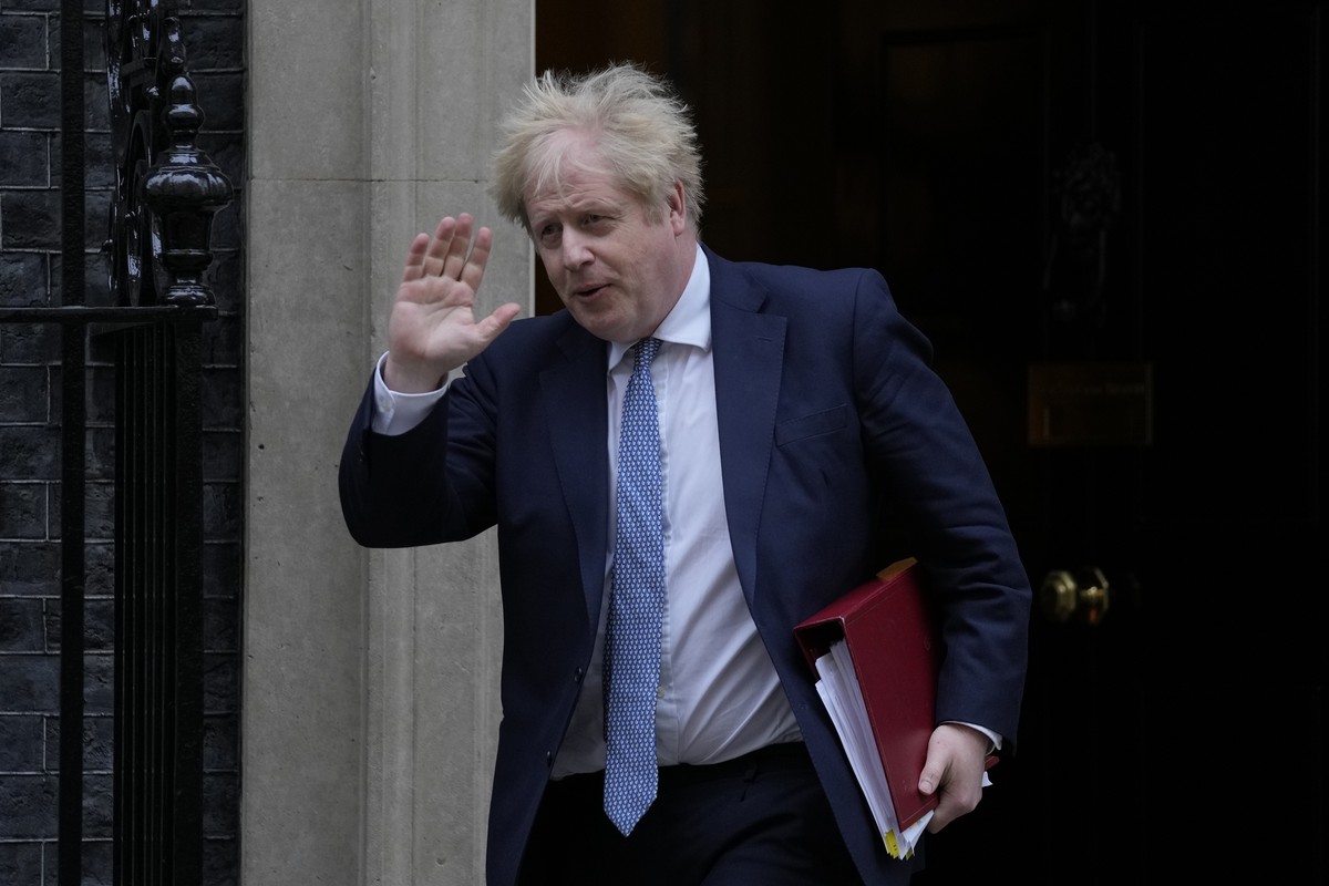 Britain's Prime Minister Boris Johnson leaves 10 Downing Street for the House of Commons for his weekly Prime Minister's Questions in London, Wednesday, Feb. 2, 2022. (AP Photo/Alastair Gran ...