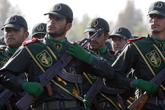 In this Sept. 21, 2008 file photo, Iranian Revolutionary Guard members march during a parade ceremony, marking the 28th anniversary of the onset of the Iran-Iraq war (1980-1988), just outside Tehran, ...