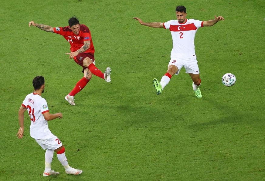 epa09289105 Steven Zuber (C) of Switzerland takes a shot at goal during the UEFA EURO 2020 group A preliminary round soccer match between Switzerland and Turkey in Baku, Azerbaijan, 20 June 2021. EPA/ ...