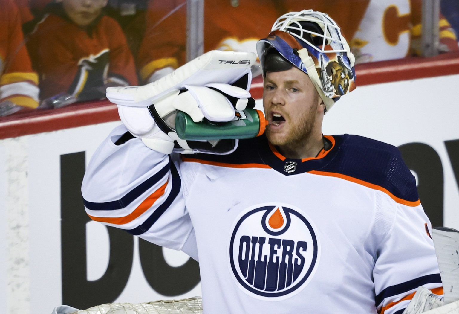 Edmonton Oilers goalie Mikko Koskinen takes a drink after letting in a goal by the Calgary Flames during the third period of Game 1 of an NHL hockey second-round playoff series Wednesday, May 18, 2022 ...