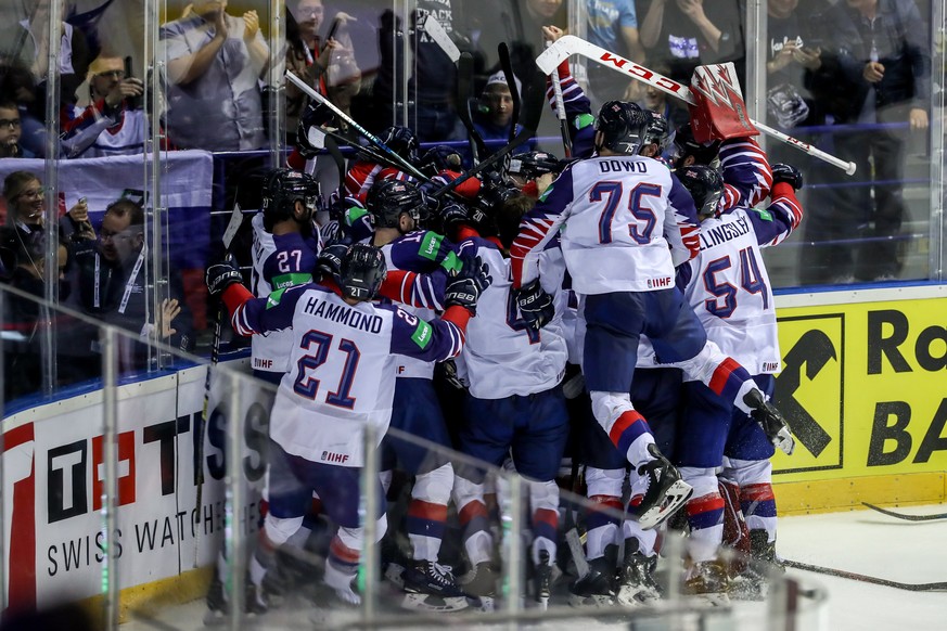 epa07587388 Players of Great Britain celebrates goal in overtime during the IIHF World Championship group A ice hockey match between France and Great Britain at the Steel Arena in Kosice, Slovakia, 20 ...