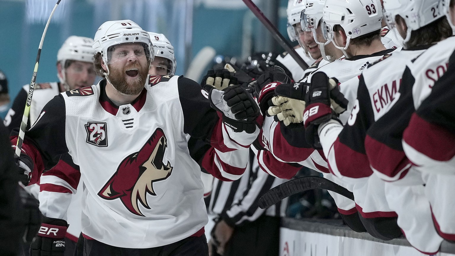 FILE- In this May 7, 2021, file photo, Arizona Coyotes right wing Phil Kessel (81) celebrates at the bench after scoring a goal against the San Jose Sharks during the third period of an NHL hockey gam ...