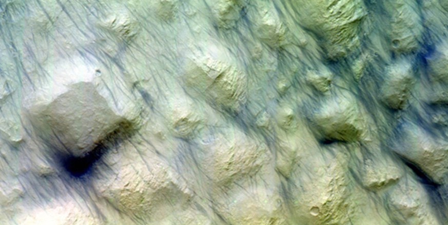 The Colour and Stereo Surface Imaging System, CaSSIS, onboard the joint ESA-Roscosmos ExoMars Trace Gas Orbiter imaged the Ariadne Colles region at 34ºS on 2 September 2018.

The image shows an unusua ...
