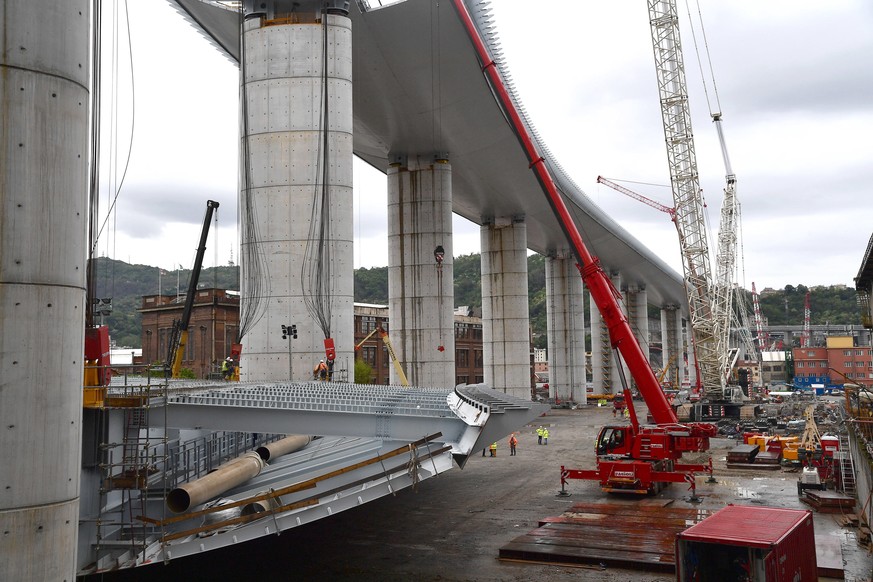 epa08373818 A general view of the new Genoa motorway bridge construction site, in Genoa, northern Italy, 20 April 2020. The new bridge is under construction after the Morandi highway bridge partially  ...