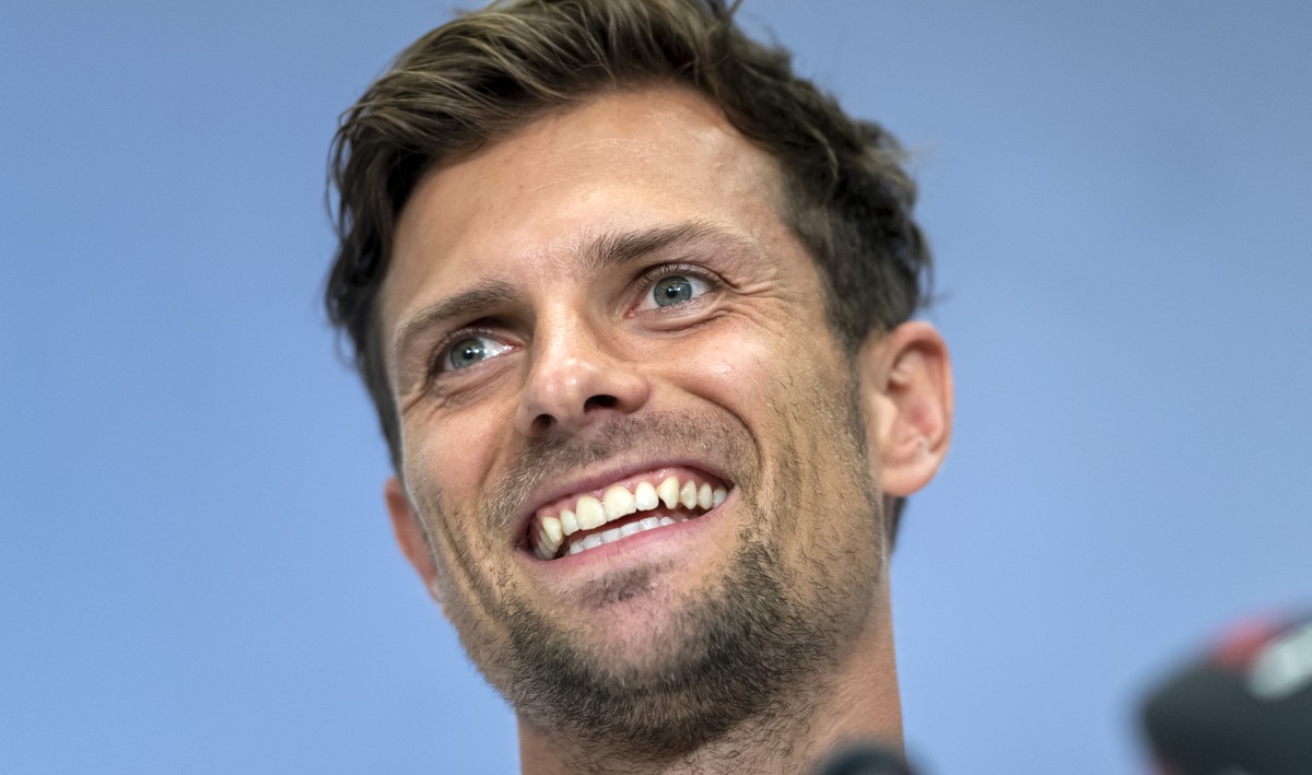 Basel's Valentin Stocker smiles during a press conference the day before the UEFA Champions League third qualifying round first leg match between Switzerland's FC Basel 1893 and Austria' ...