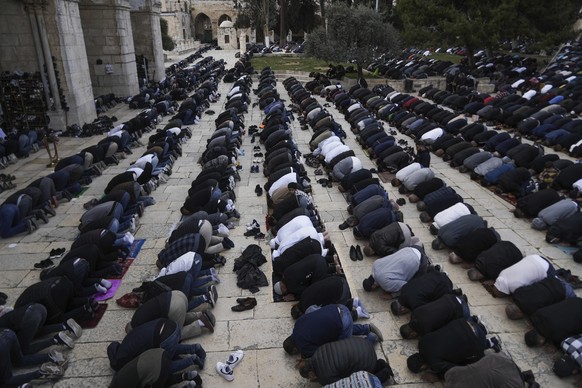 Muslim worshipers perform Friday prayers on the grounds of Al-Aqsa Mosque in Jerusalem's Old City during the Muslim holy month of Ramadan on Friday, March 15, 2024. (AP Photo/Mahmoud Illean)