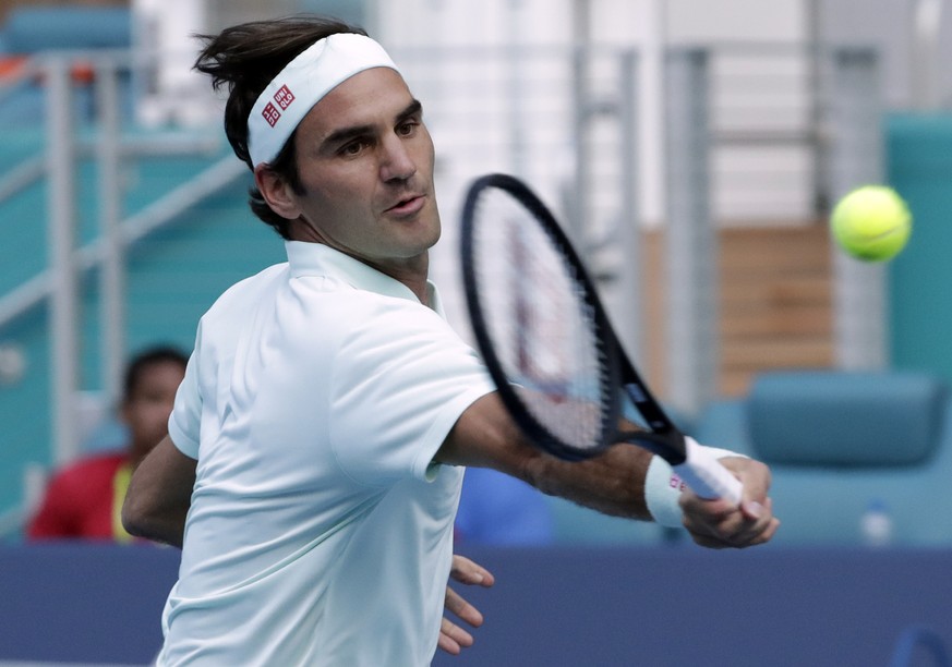 Roger Federer, of Switzerland, returns to Radu Albot, of Moldova, during the Miami Open tennis tournament, Saturday, March 23, 2019, in Miami Gardens, Fla. (AP Photo/Lynne Sladky)