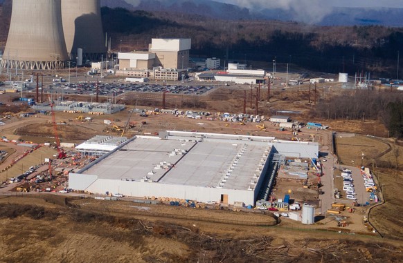 FILE - A data center owned by Amazon Web Services, front right, is under construction next to the Susquehanna nuclear power plant in Berwick, Pa., Jan. 14, 2025. (AP Photo/Ted Shaffrey, File)
Labor Un ...