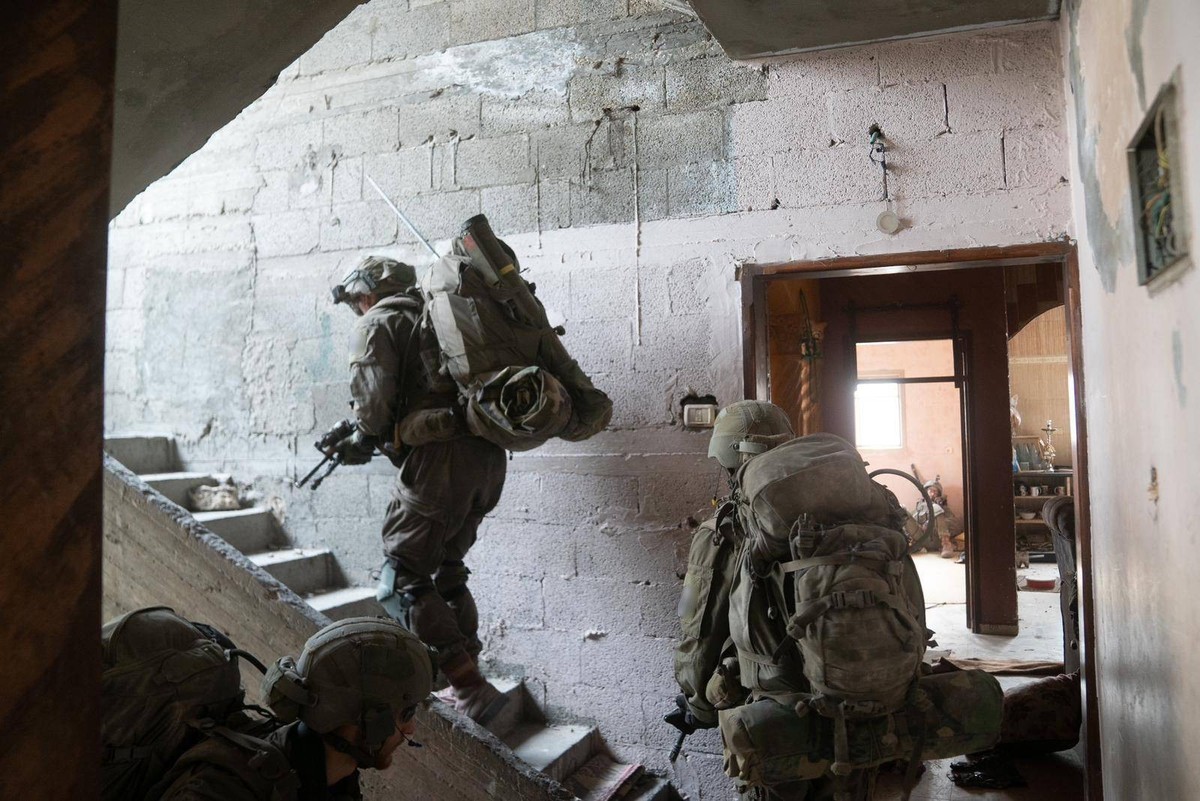 231117 -- GAZA, Nov. 17, 2023 -- This photo released by the Israel Defense Forces on Nov. 16, 2023 shows Israeli troops conducting military operations in western Gaza City. /Handout via Xinhua MIDEAST ...