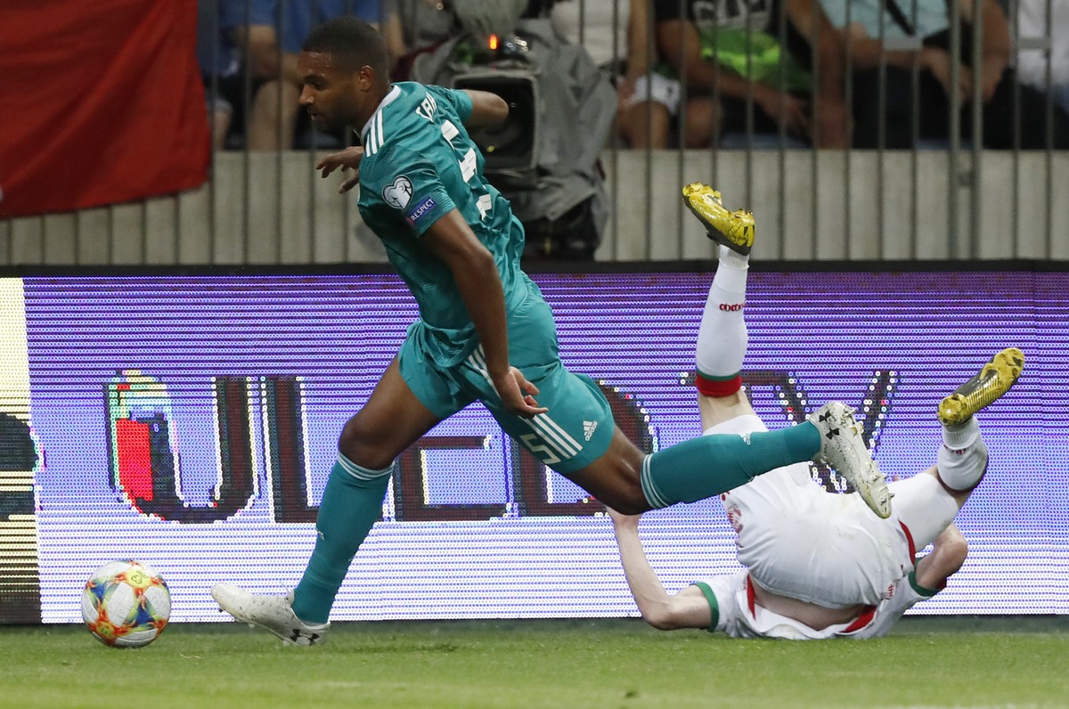 Germany's Jonathan Tah, left, fights for the ball with Belarus' Yury Kavalev during the Euro 2020 group C qualifying soccer match between Belarus and Germany at the Borisov-Arena in Borisov, ...