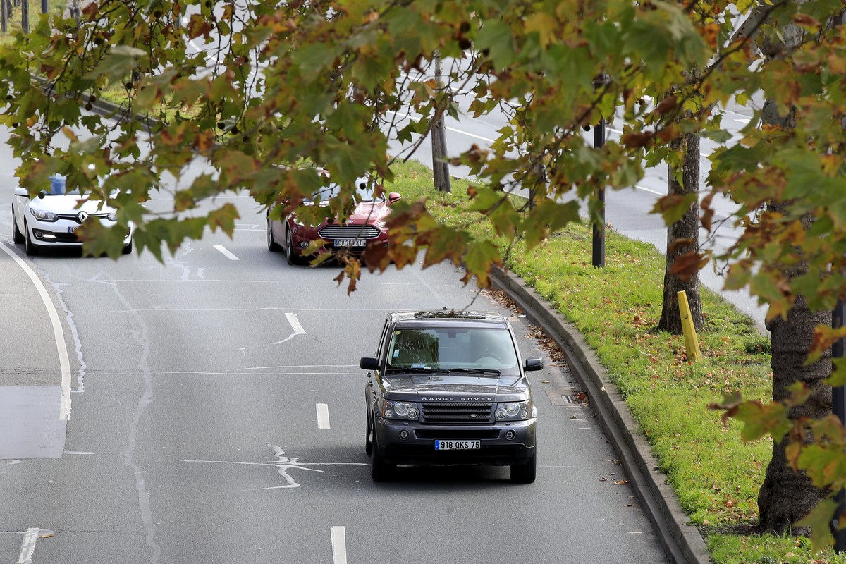A SUV drives Wednesday, Nov. 13, 2019 in Paris. The world's thirst for oil will continue to grow until the 2030s, with climate-damaging emissions climbing until at least 2040 â?? and consumers  ...