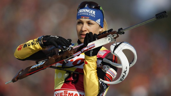 Magdalena Neuner of Germany prepares for a warm up shooting prior to the Women's 7.5 km Sprint competition at the Biathlon World Championships in Ruhpolding, Germany, Saturday, March 3, 2012. (AP Phot ...