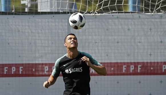 Portugal&#039;s Cristiano Ronaldo heads the ball during the training session of Portugal at the 2018 soccer World Cup in Kratovo, outskirts Moscow, Russia, Friday, June 22, 2018. (AP Photo/Francisco S ...