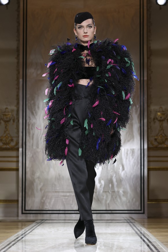 A model wears a creation as part of the Giorgio Armani Prive Fall-Winter 2025/26 Haute Couture collection presented Tuesday, July 8, 2025, in Paris. (AP Photo/Tom Nicholson)
France Fashion Giorgio Arm ...