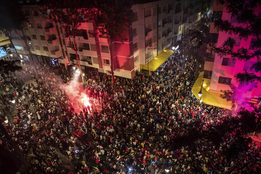 Thousands of Moroccans gather to celebrate Morocco&#039;s win over Spain in a World Cup match played in Qatar, in Rabat, Morocco, Tuesday, Dec. 6, 2022. (AP Photo/Mosa&#039;ab Elshamy)