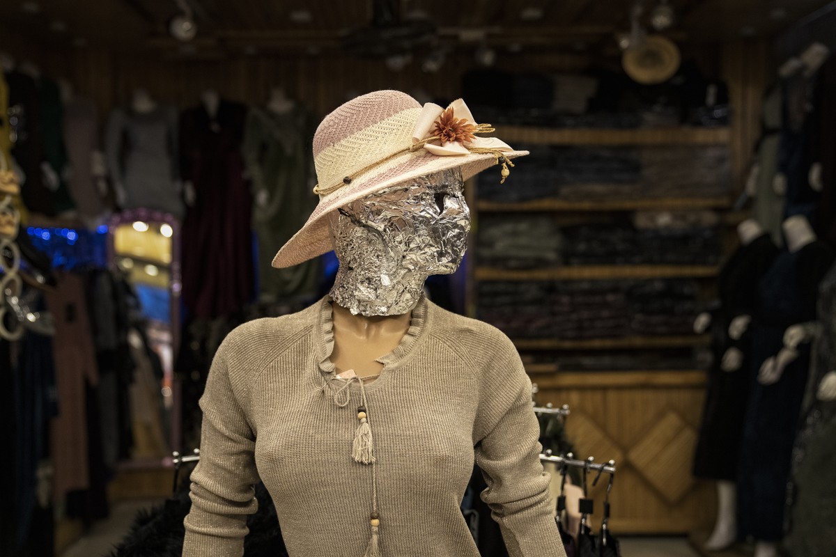 A mannequin's head is covered in a woman dress shop in Kabul, Afghanistan, Monday, Dec. 26, 2022. Under the Taliban, the mannequins in women's dress shops across the Afghan capital Kabul are ...