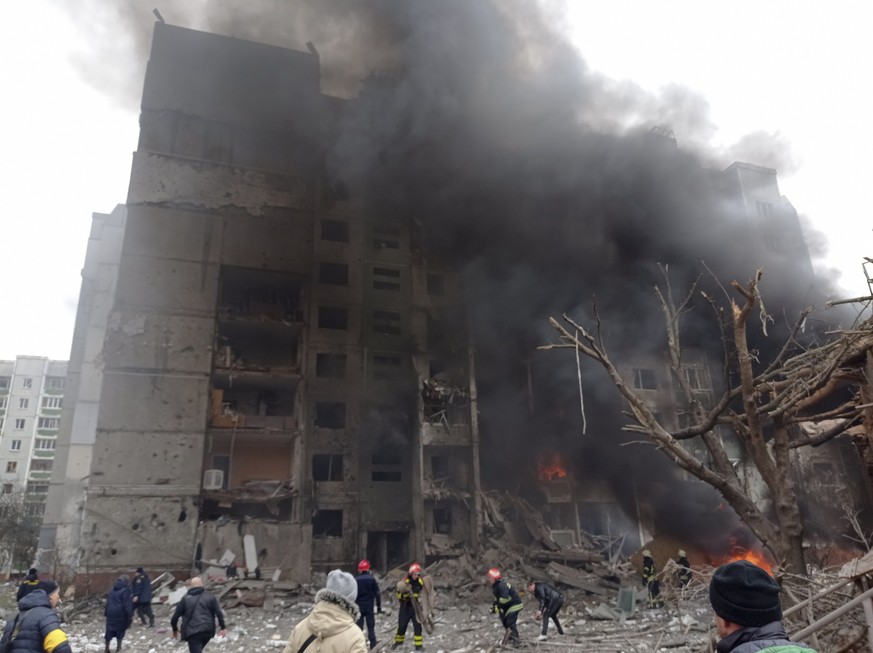 Firefighters work to extinguish a fire at a damaged city center after a Russian air raid in Chernigiv, Ukraine, Thursday, March 3, 2022. Russian forces have escalated their attacks on crowded cities i ...