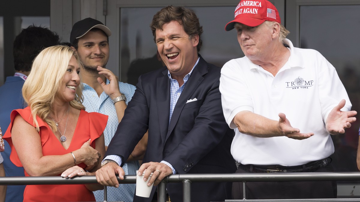 epaselect epa10100951 (L-R) Republican Congresswoman Majorie Taylor Greene of Georgia, Fox News television personality Tucker Carlson, and former US President Donald J. Trump watch the third round of  ...