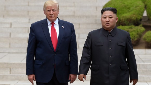 FILE - President Donald Trump, left, meets with North Korean leader Kim Jong Un at the North Korean side of the border at the village of Panmunjom in Demilitarized Zone, June 30, 2019. (AP Photo/Susan ...