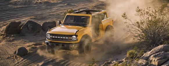 Pre-production versions of the 2021 Bronco, shown here, include Bronco two-door in Cyber Orange Metallic Tri-Coat and Bronco four-door in Cactus Gray. 2021 Ford Bronco 4x4 offroader auto retro design  ...