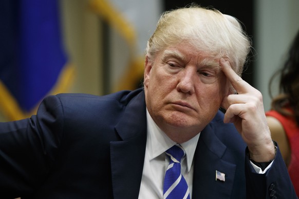 President Donald Trump listens during a meeting with women small business owners in the Roosevelt Room of the White House, in Washington, Monday, March 27, 2017. (AP Photo/Evan Vucci)