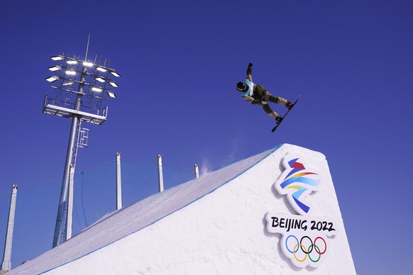 Bianca Gisler of Switzerland competes during the women&#039;s snowboard big air qualifications of the 2022 Winter Olympics, Monday, Feb. 14, 2022, in Beijing. (AP Photo/Ashley Landis)