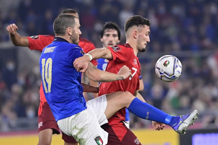 Italy&#039;s defender Leonardo Bonucci, left, fights for the ball against Switzerland&#039;s forward Andi Zeqiri, right, during the 2022 FIFA World Cup European Qualifying Group C match between Italy  ...