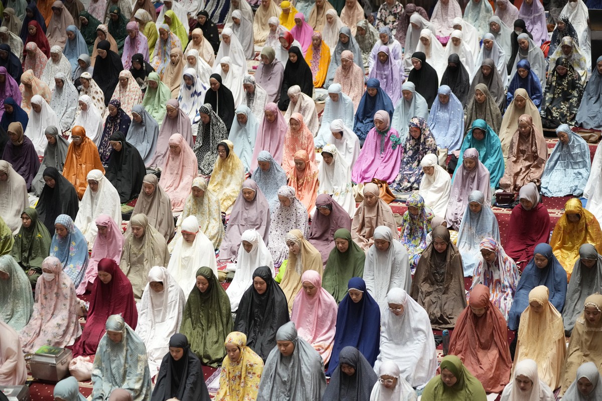Indonesian Muslims perform an evening prayer called 'tarawih' marking the first eve of the holy fasting month of Ramadan, at Istiqlal Mosque in Jakarta, Indonesia, Wednesday, March 22, 2023. ...