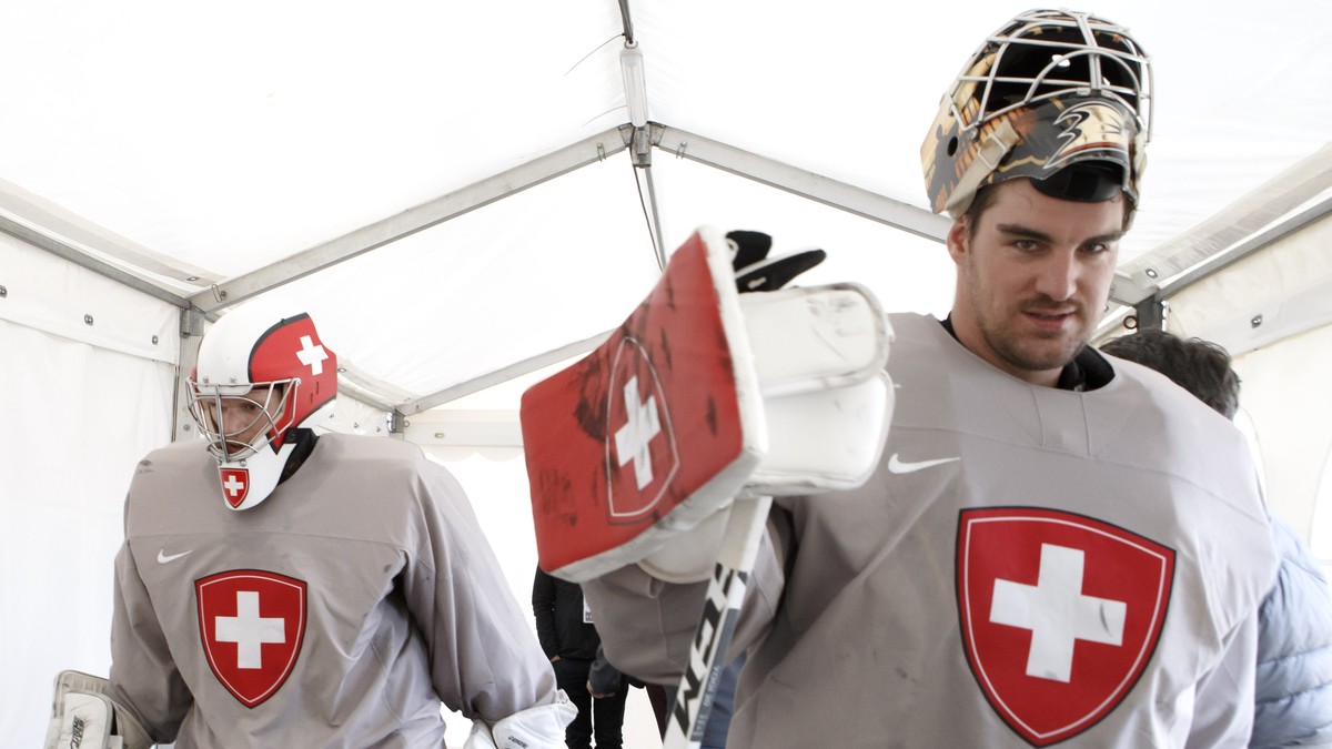 Switzerland's goaltender Leonardo Genoni, left, and Switzerland's goaltender Reto Berra, return to cloakroom, after a training session of the IIHF 2018 World Championship at the practice are ...