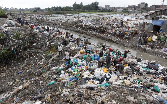 Scavengers search for recyclable materials at the Dandora dumping site on the outskirts of Kenya's capital Nairobi June 5, 2015. The dumping site was declared a health hazard for the neighbouring ...