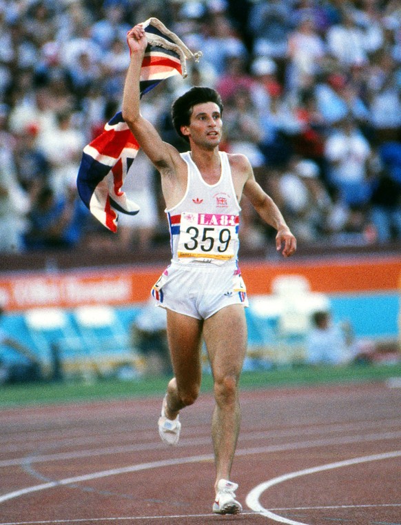 Athletics - 1984 Los Angeles Olympics - Men s 1500 metres Final Great Britain s Sebastian Coe with the Union Jack flag on his lap of honour after winning gold in the Los Angeles Memorial Coliseum. Coe ...