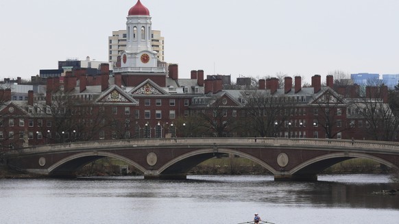FILE - A sculler rows down the Charles River near Harvard University, at rear, April 15, 2025, in Cambridge, Mass. (AP Photo/Charles Krupa, File)
AP Poll AAPI Adults Higher Education