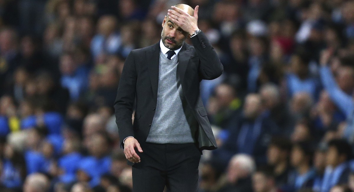 Manchester City's manager Pep Guardiola gestures during the Champions League round of 16 first leg soccer match between Manchester City and Monaco at the Etihad Stadium in Manchester, England, Tu ...