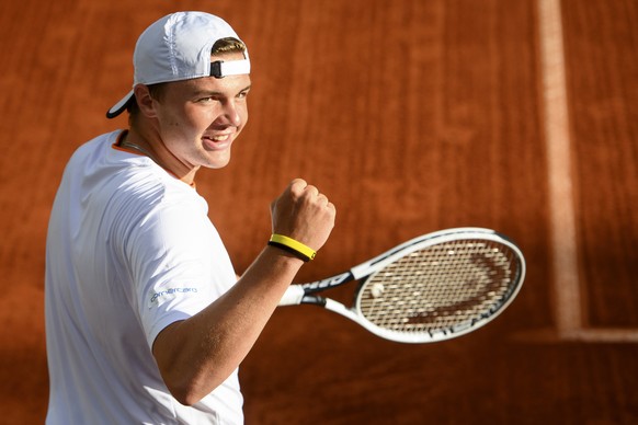 epa09212753 Dominic Stephan Stricker of Switzerland celebrates after winning his second round match against Marton Fucsovics of Hungaria at the ATP 250 Geneva Open tennis tournament in Geneva, Switzer ...