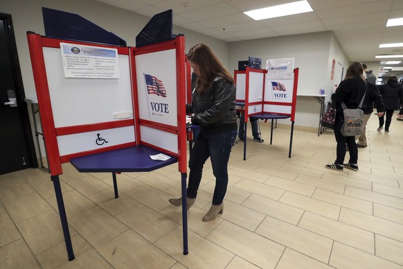 Nikki Foster, democratic candidate for Ohio's first congressional district, votes early at the Warren County Board of Elections, Saturday, March 14, 2020, in Lebanon, Ohio. (AP Photo/Aaron Doster ...