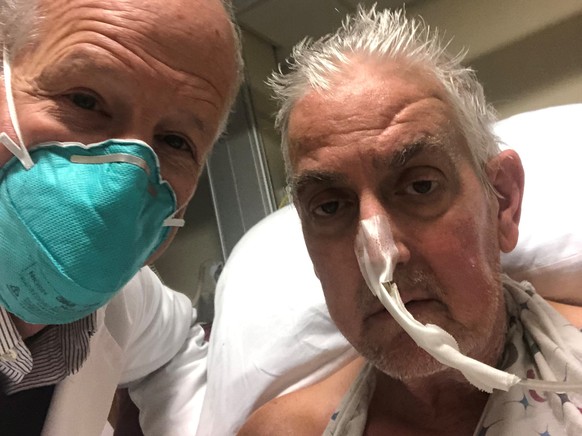 epa09677904 A handout photo made available by the University of Maryland School of Medicine (UMSOM) that shows Surgeon Bartley P. Griffith, MD with 57-year-old patient, David Bennett, prior to a succe ...