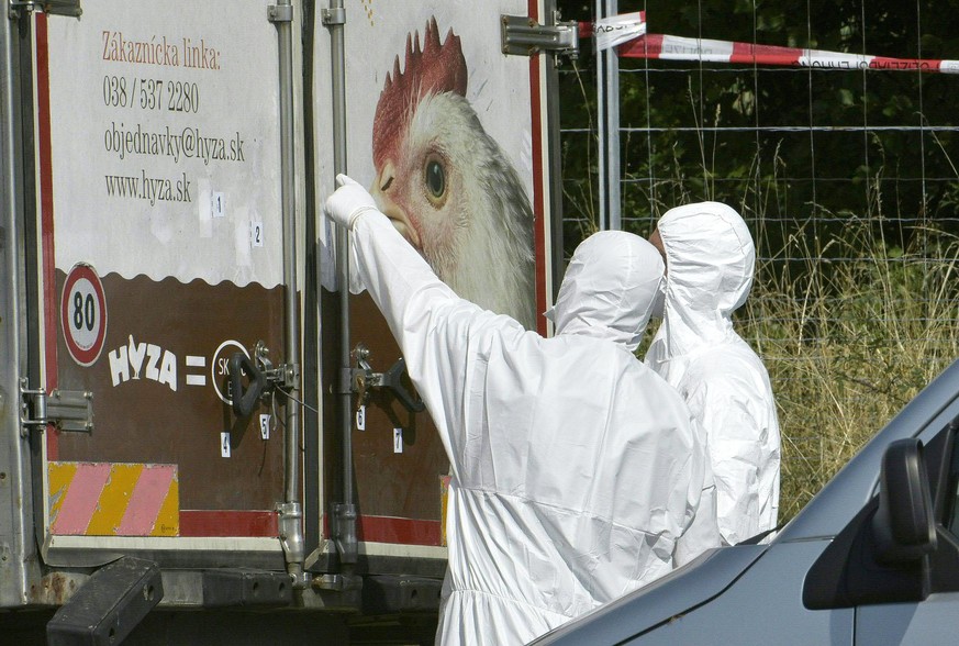 epa06040743 (FILE) - Forensic experts investigate a truck in which refugees were found dead as it stands on freeway autobahn A4 between Parndorf and Neusiedl, Austria, 27 August 2015 (reissued 21 June ...